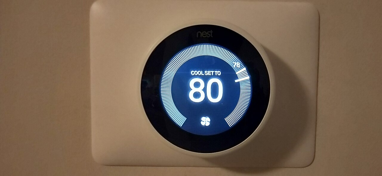 A wall thermostat set to cool